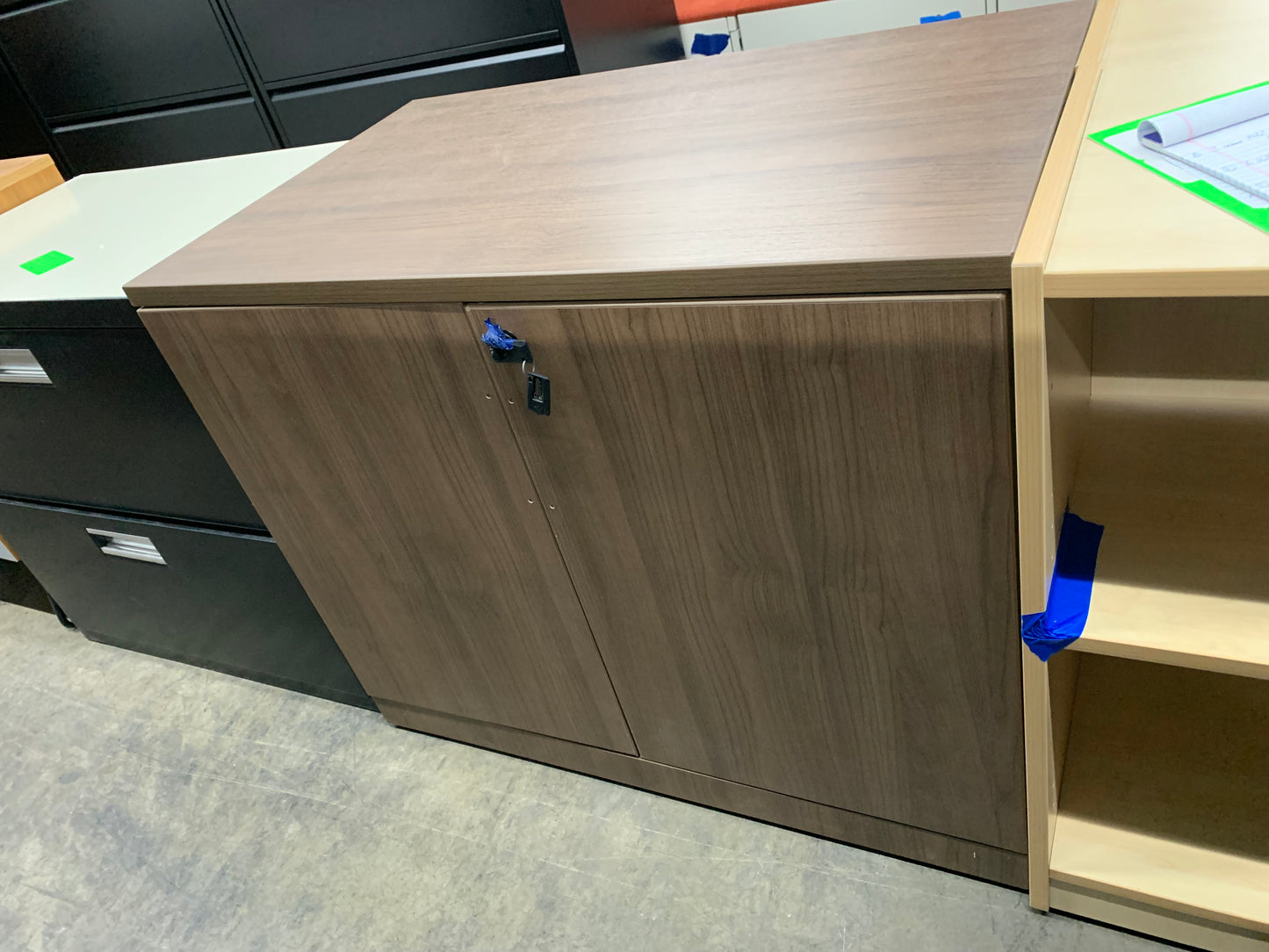 Pre-Owned 2 shelf walnut storage cabinet with doors